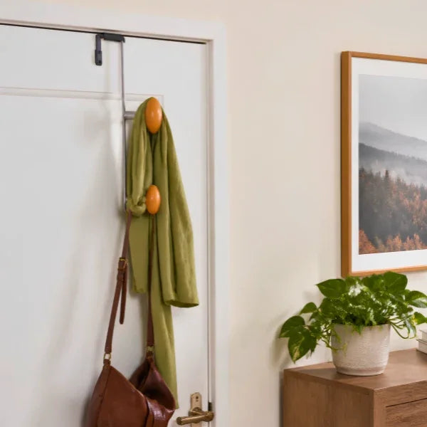 Alba double door mounted coat peg holding a green scarf and brown leather bag