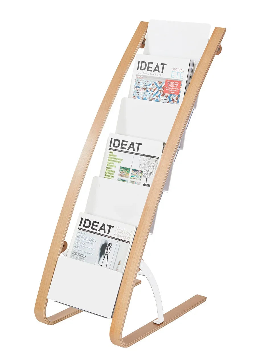 Six-compartment floor display stand with black, silver, and grey accents, holding magazines