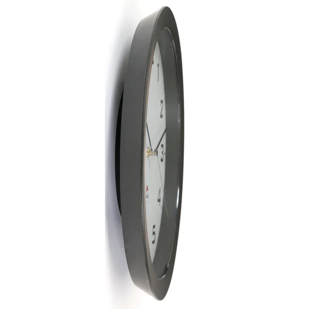 Modern black wall clock with white face and gold hands, ideal for office or home workspace time management.