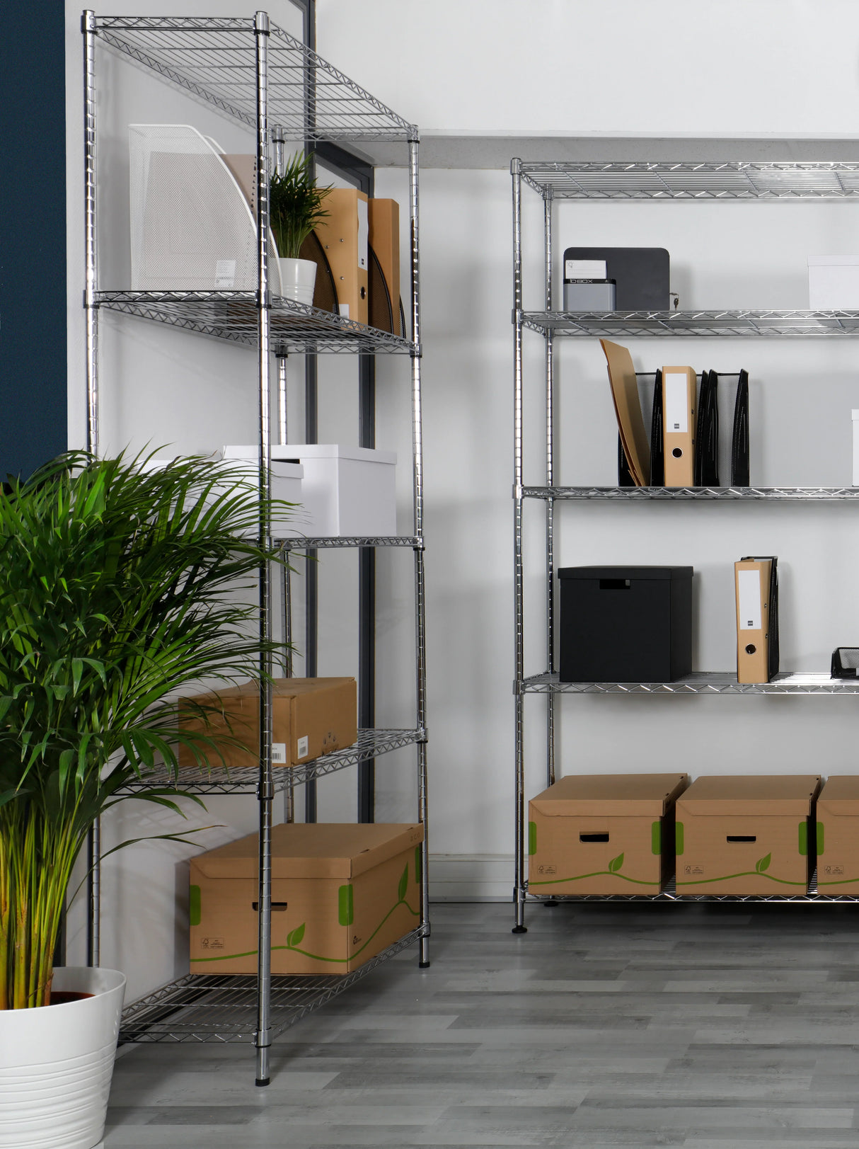 Mesh metal magazine holder in silver grey on office shelving with files and storage boxes