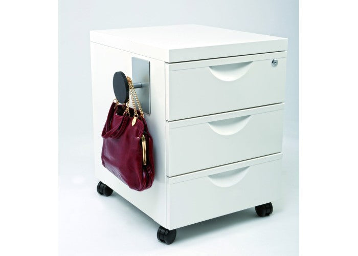 Black magnetic peg hook attached to a white office drawer, holding a red handbag