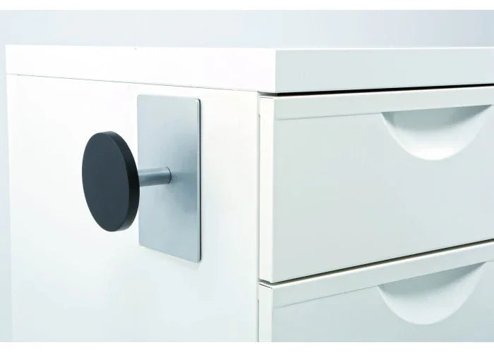 Magnetic black peg hook attached to white office cabinet for organizing workspace items
