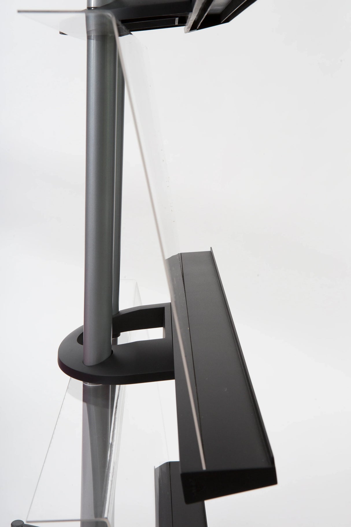 Side view of a chrome A4 display stand with clear angled compartments