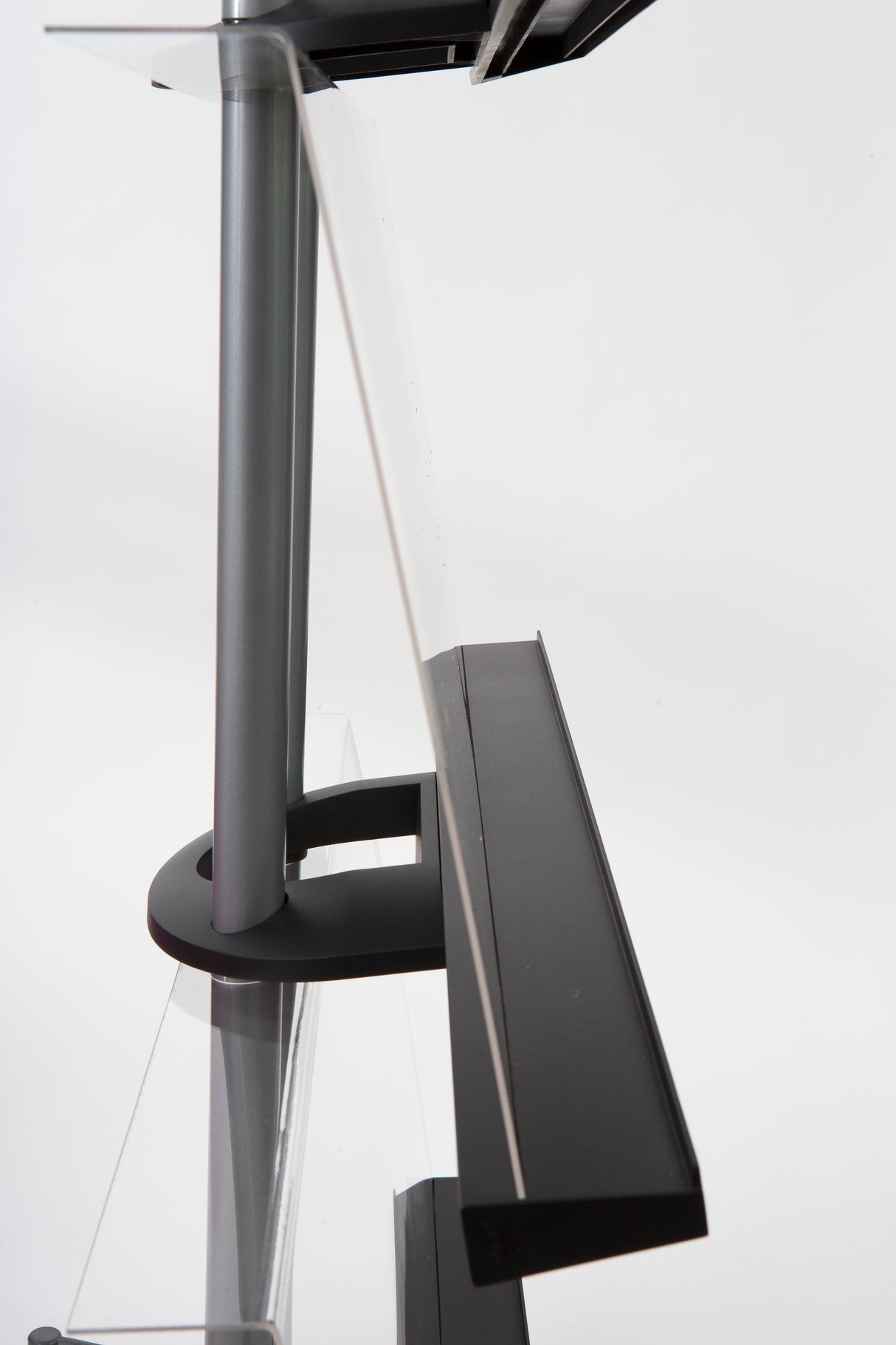 Side view of a chrome A4 display stand with clear angled compartments