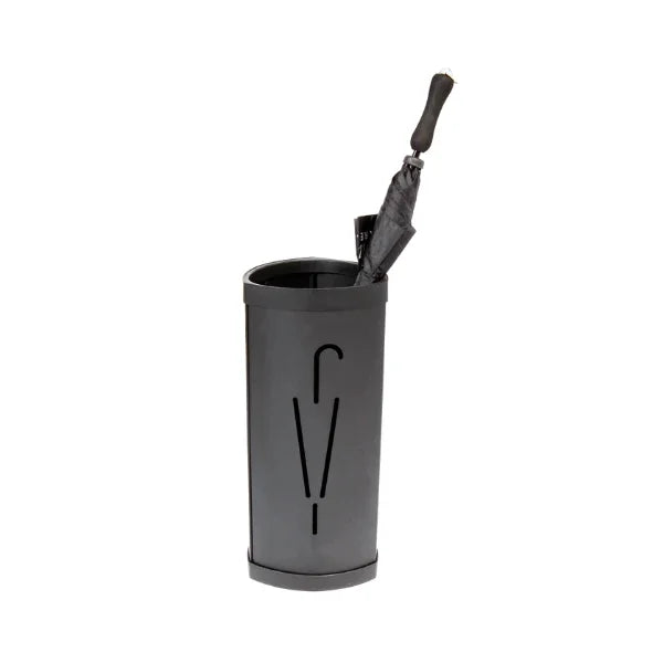 Black oval metal umbrella stand with cutout design, holding a closed black umbrella