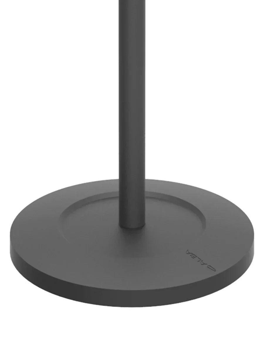 Black circular base and pole of a standing desk, designed for stable workspace solutions.