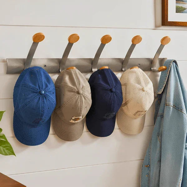 Alba wall mounted double peg rail with baseball caps and a denim jacket