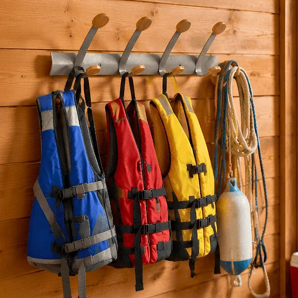 Alba wall mounted double peg rail holding life jackets and nautical ropes on a wood wall