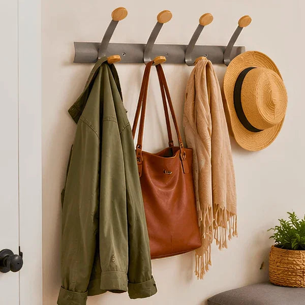 Alba wall mounted double peg rail holding a green jacket, brown handbag, scarf, and straw hat.