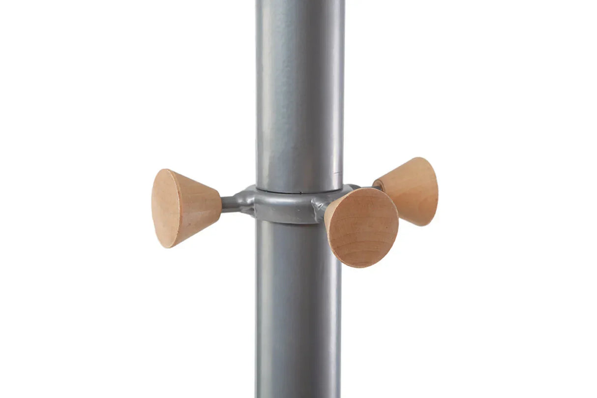 Metal pole with wooden pegs for hanging coats or hats in office or home workspace