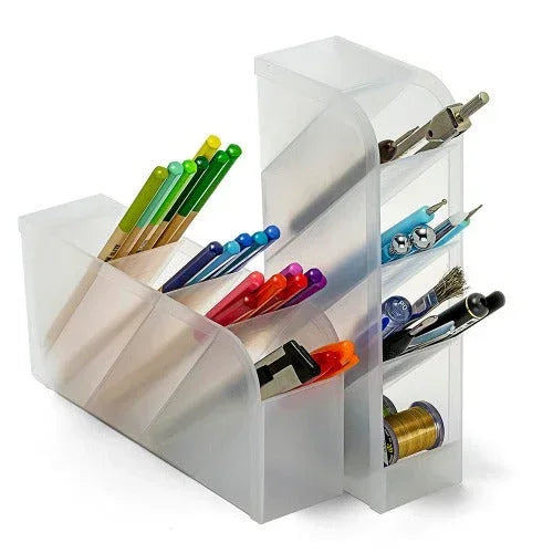Clear plastic desk organizer with pens, pencils, and office supplies for workspace productivity