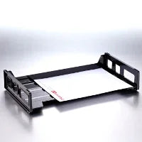 Black desktop letter tray with white paper on a reflective surface, office organizer