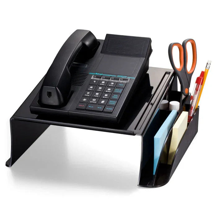 Black desktop telephone stand with organizer slots holding scissors, pens, and sticky notes