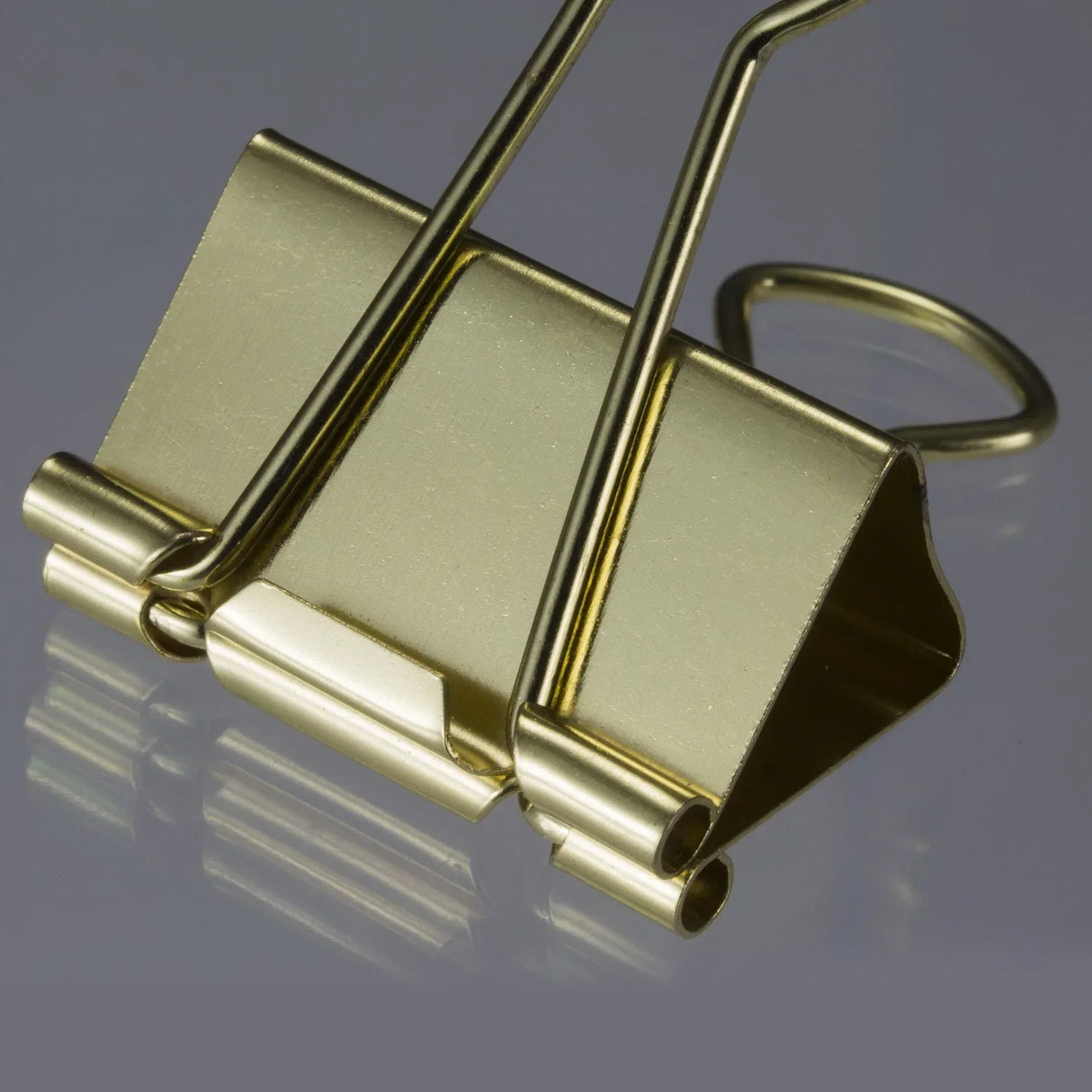 Golden binder clip for office organization and document management