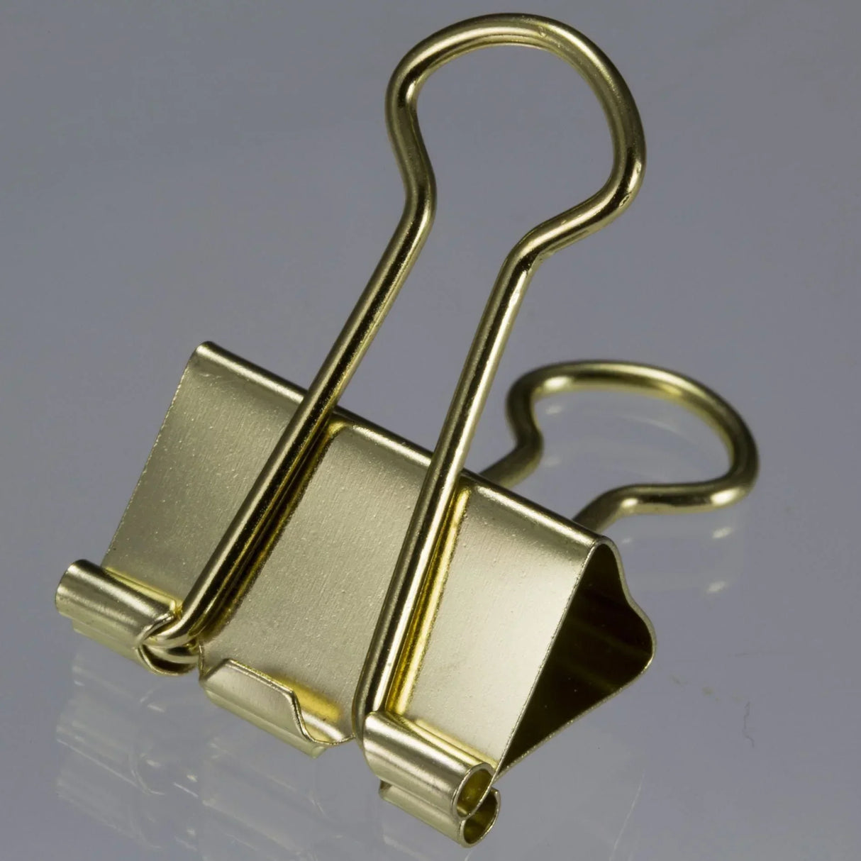 Golden binder clip for office organization and document management