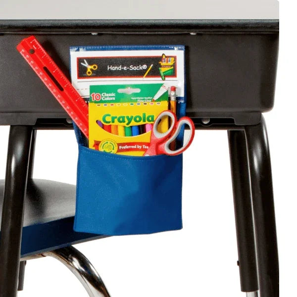 Blue pocket on a black chair with school supplies including a ruler, crayons, and scissors.