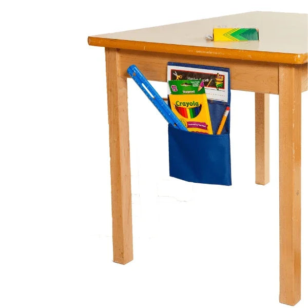 Wooden table with a blue pocket holding school supplies on a white background