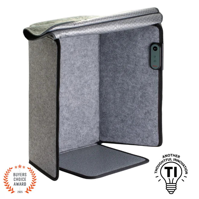 Gray portable foot and leg heater with soft fabric panels, control button, and award badges.