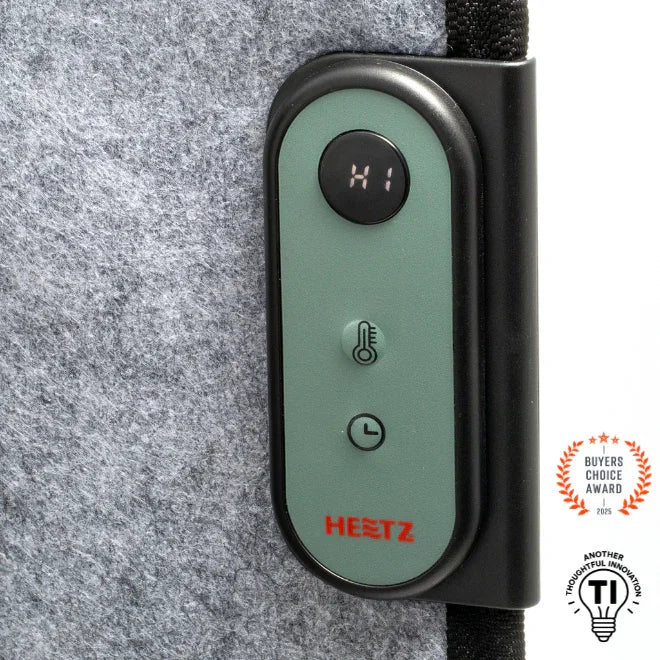 Heetz foot and leg heater control panel with temperature and timer buttons on grey fabric