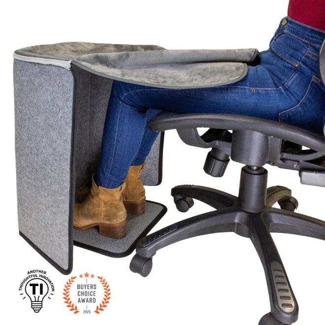 Foot and leg heater placed under desk with person sitting in office chair, promoting workspace comfort.