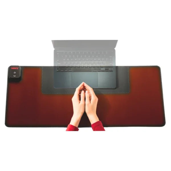 Heetz™ large grounding desk pad with a laptop and hands resting on the heated earthing mat