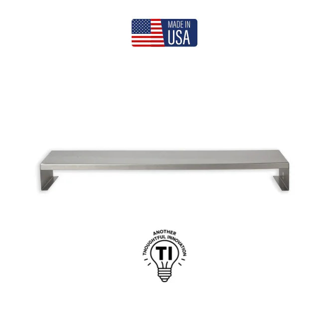 Stainless steel monitor riser or desk organizer with minimalist design, Made in USA label.
