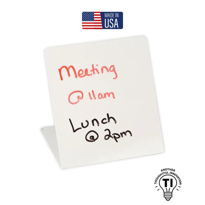 White desktop dry erase board with handwritten meeting and lunch reminders, Made in USA label