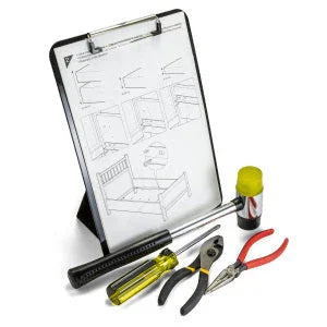 Magnetic clipboard with easel back holding assembly instructions, displayed with hand tools