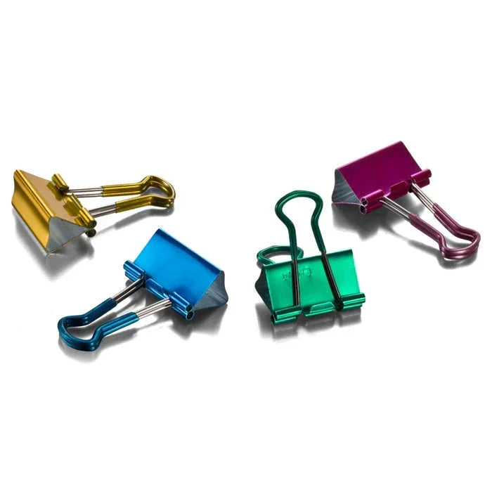 Colorful metal binder clips in gold, blue, green, and purple for office organization