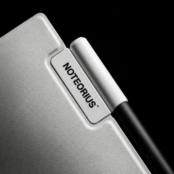Close-up of a smart gray digital notebook with pen and NOTEORIUS label