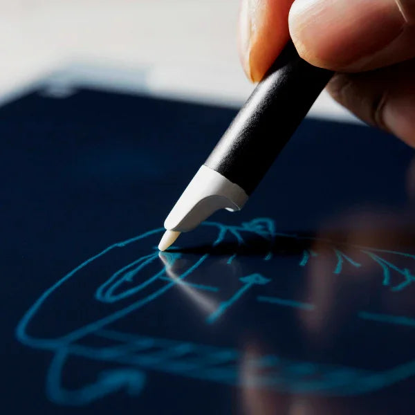 Hand writing digital notes with a stylus on a smart notebook tablet screen