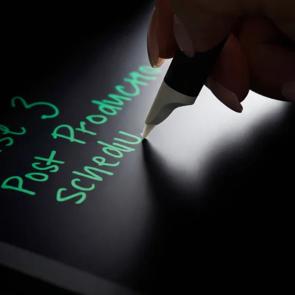 Hand writing digital notes with stylus on smart notebook tablet screen