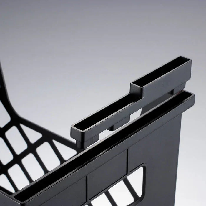 Close-up of black recycled desktop file organizer with slotted compartments for office use