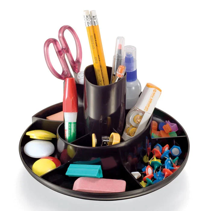 Rotary desk organizer holding office supplies like scissors, pencils, erasers, push pins, and glue.