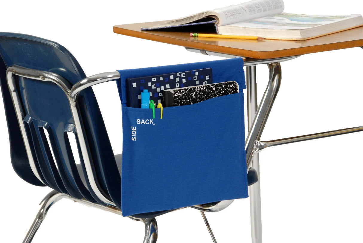 Blue Seat Sack Side Sack hanging on a classroom chair, holding school supplies and notebooks.