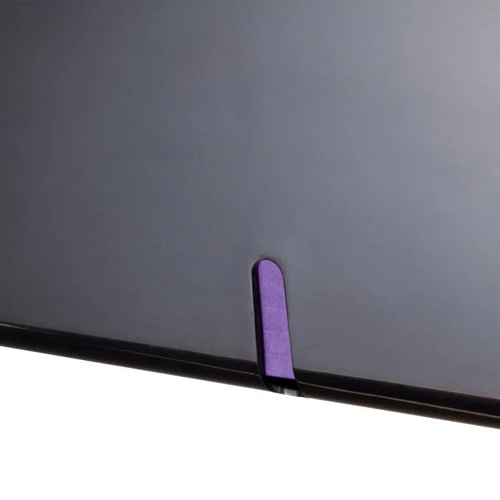 Close-up of black plastic file organizer with purple tab for office document storage