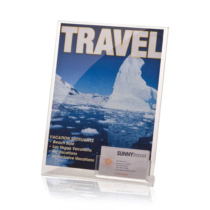 Clear acrylic sign holder with business card pocket displaying a travel flyer