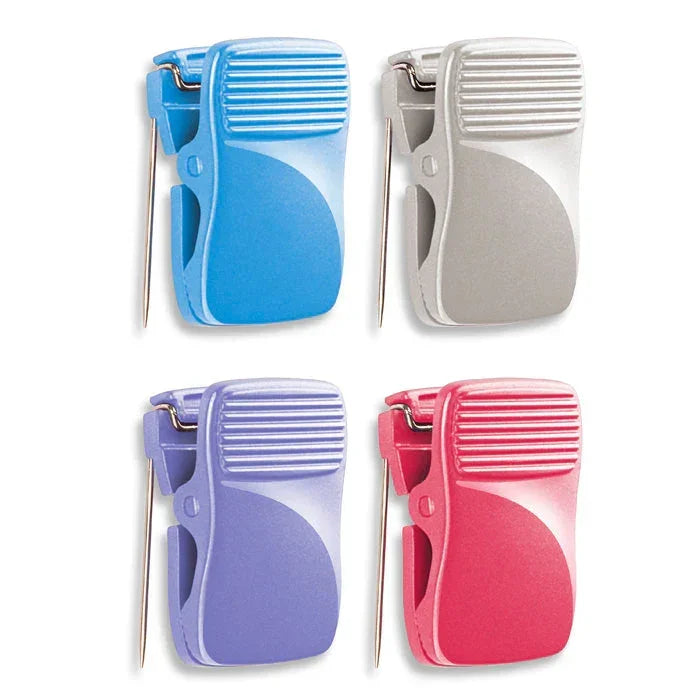 Colorful plastic binder clips in blue, silver, purple, and pink for organizing papers and documents