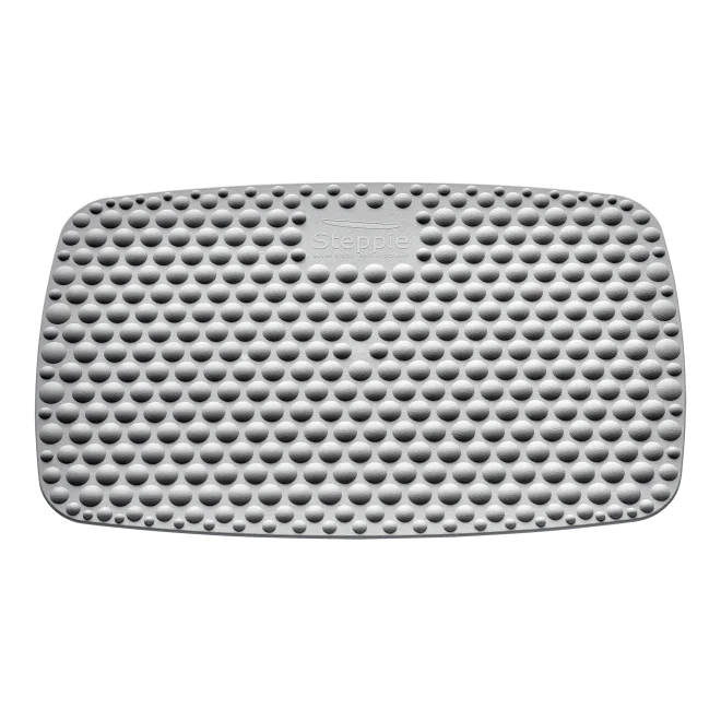 Gray textured standing desk mat with bubble pattern, ergonomic anti-fatigue floor mat