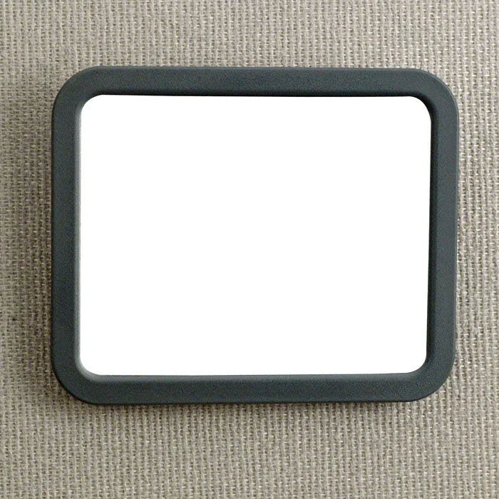 Rectangular office cubicle mirror with black frame attached to fabric panel
