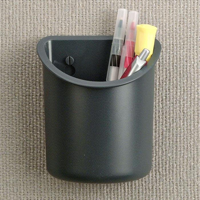Black wall-mounted pen holder with pens and highlighters for office organization