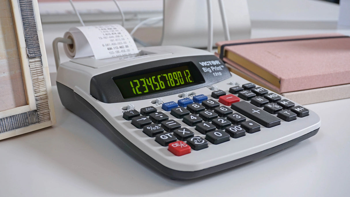 Thermal printing calculator with large digital display and receipt paper on a desk