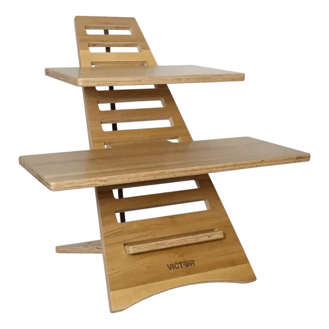 Wooden standing desk converter with dual tiers and slatted back, ideal for ergonomic workspace setup