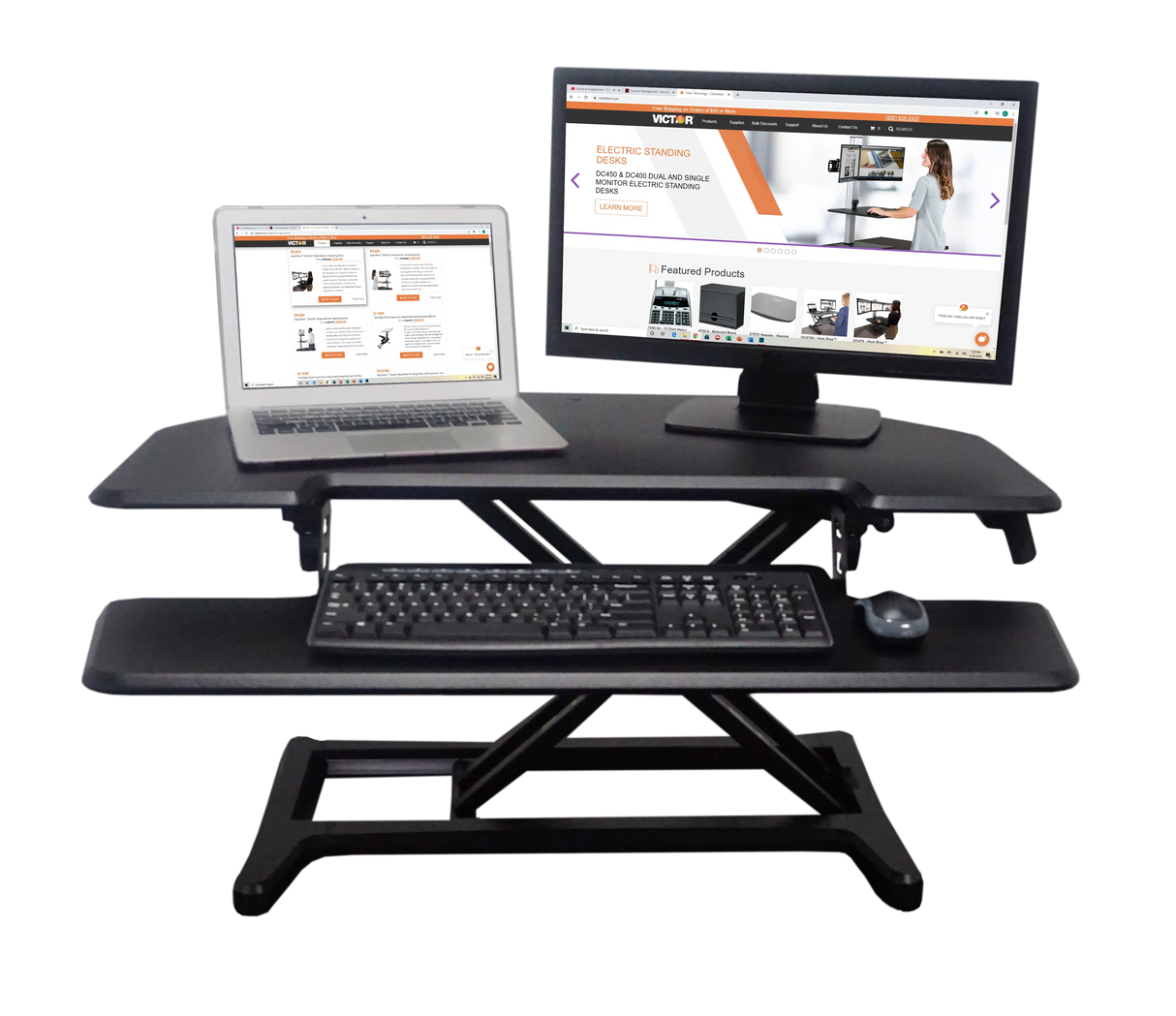 Adjustable corner standing desk with laptop, monitor, keyboard, and removable tray