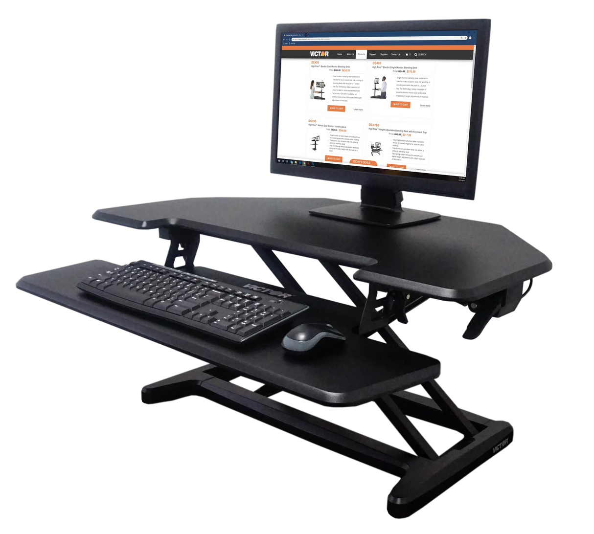 Black corner standing desk riser with adjustable height, monitor, keyboard, and mouse