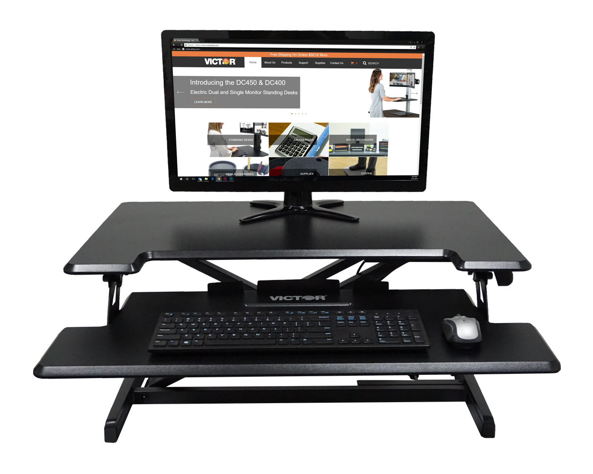 Adjustable height standing desk with keyboard tray, monitor, keyboard and mouse