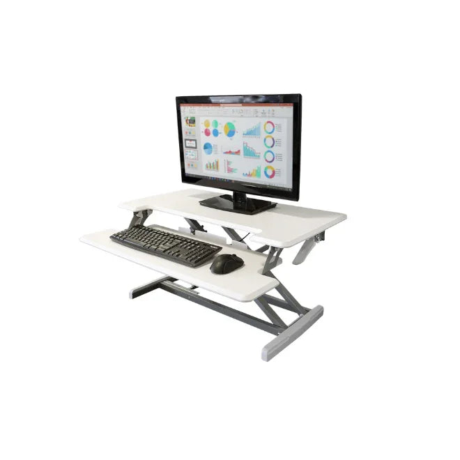 Adjustable height white standing desk with keyboard tray, monitor, keyboard, and mouse