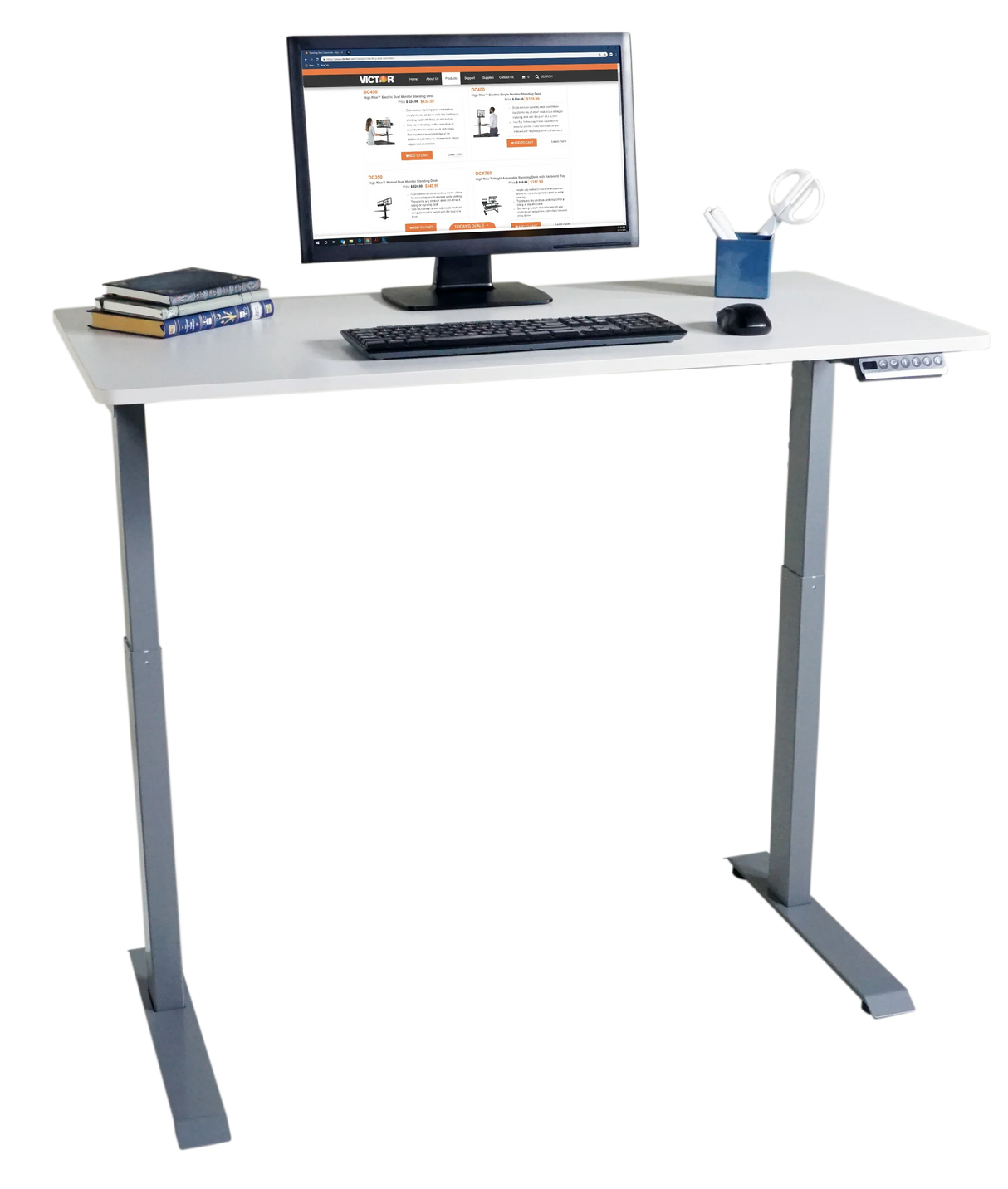 Electric height adjustable standing desk with computer monitor, books, and office accessories