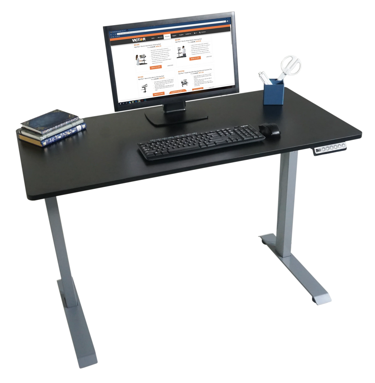 Black electric adjustable standing desk with monitor, keyboard, books, and office accessories