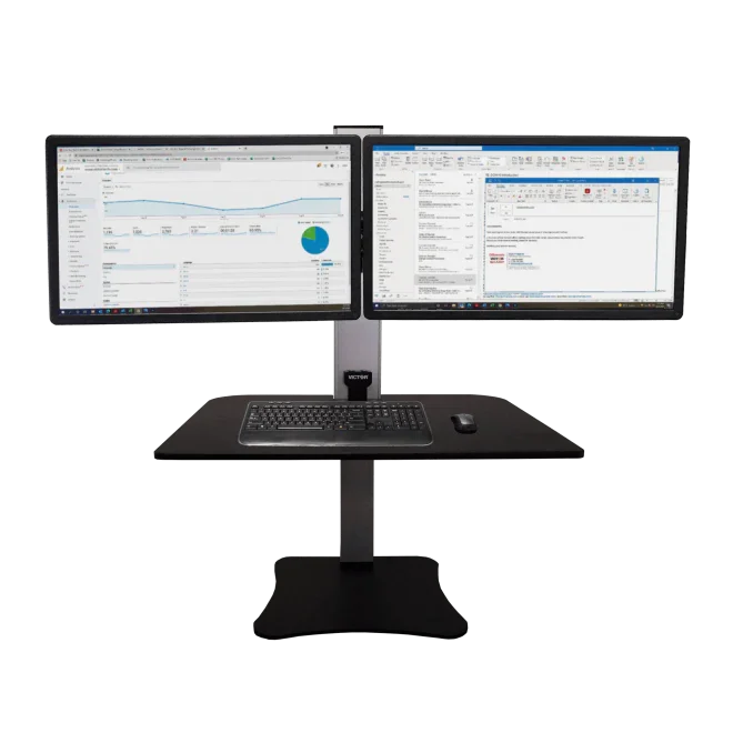 Electric standing desk with dual monitors, keyboard, and mouse workstation setup